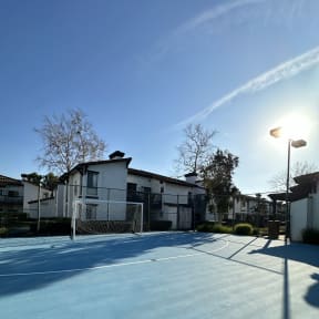 a view of the side of a building and sports court