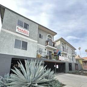 a view of the side of a building with a cactus at The Marq Apartments LLC, Los Angeles, California