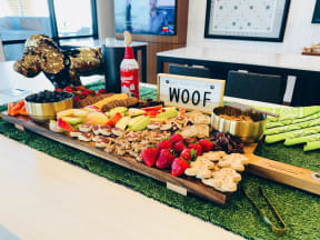 a wooden platter of food on a table