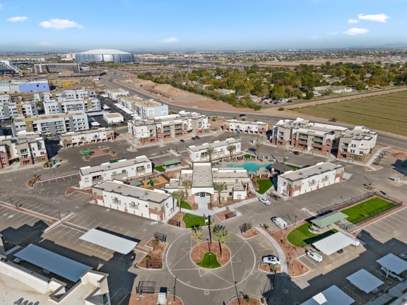 an aerial view of a city with buildings and a parking lot