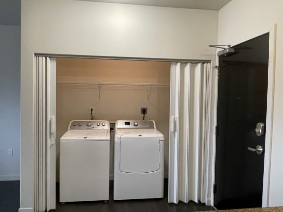 a laundry room with two washes and a dryer in it
