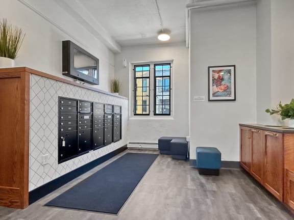 the lobby of a building with a locker room and a television