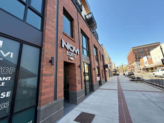 A street view of a building with the name INOM LOFIS on it.