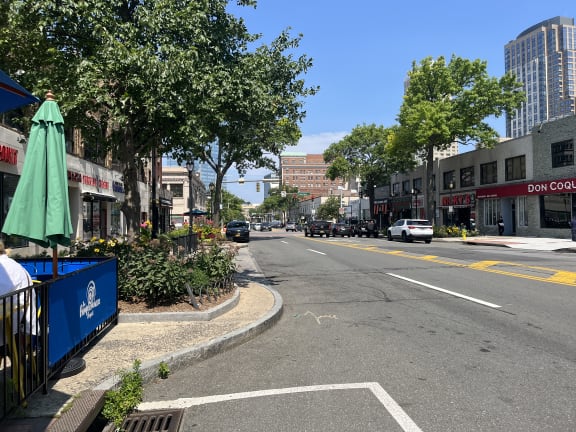 a city street with a building on the side of the road