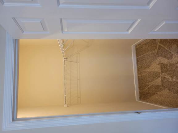 A white door with a window in the middle.