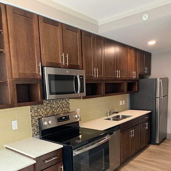 a view of a kitchen with counters and appliances