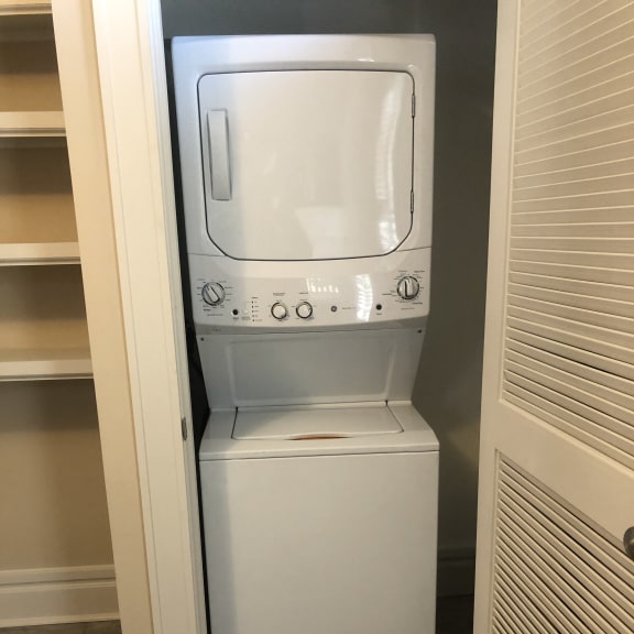 a microwave oven sitting on top of a shelf