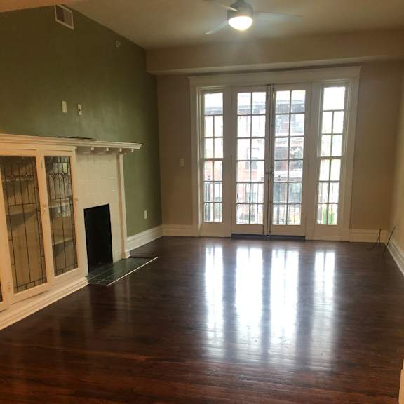 an empty room with a large window and a glass counter top