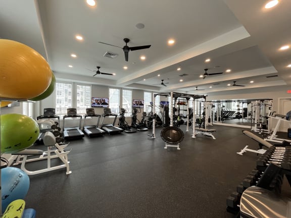 a spacious fitness center with treadmills and other exercise equipment at The Oasis at Plymouth, Massachusetts