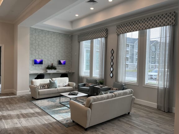 a living room filled with furniture and a large window at The Oasis at Plymouth, Massachusetts