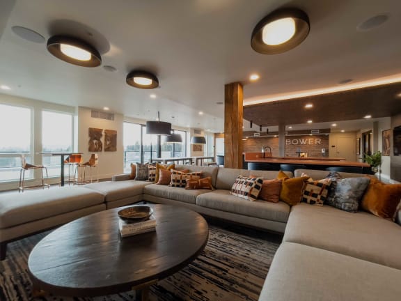 a large living room with couches and a table