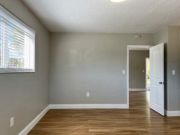 an empty room with a door and a window  at Palm Gardens @ Biscayne Gardens, Florida