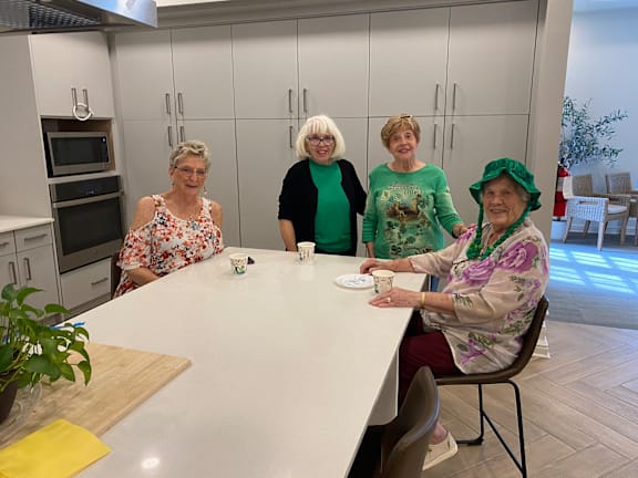 four women sitting at a table in a kitchen at LIV at Boerne Hills an Active Senior Community 62+, Boerne, TX, 78006