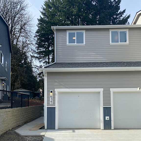 A house with a garage door opener attached to the wall.