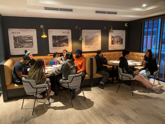 a group of people sitting around a table