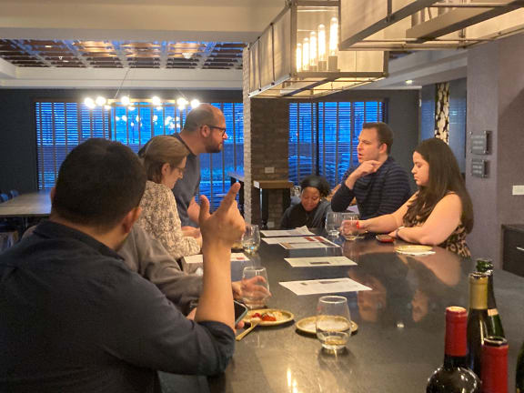 a group of people sitting around a table