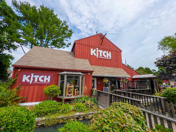 A red building with the word KITCH on it.
