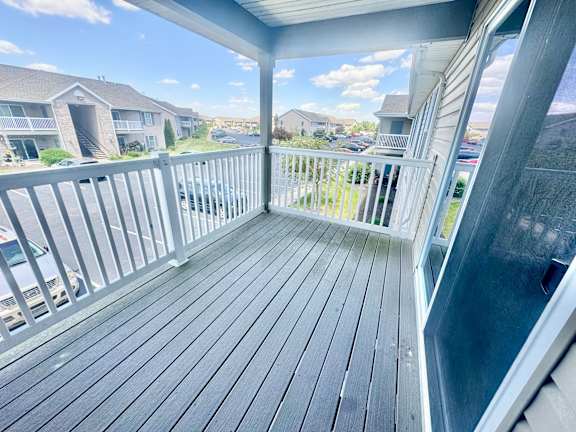 the balcony has a view of the street and the house  at Hawthorne Properties in Lafayette, IN 47905