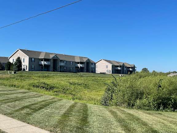 a row of houses on a hill with a blue sky  at Hawthorne Properties in Lafayette, IN 47905