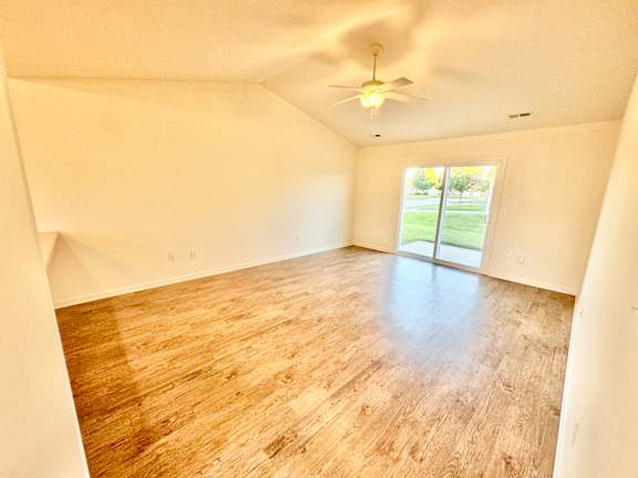 a living room with a wood floor and a ceiling fan at Hawthorne Properties in Lafayette, IN 47905