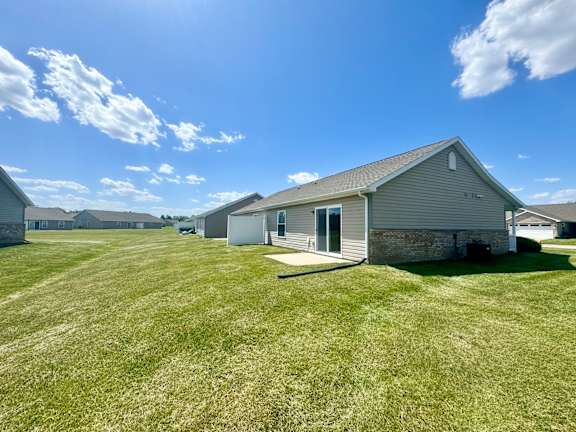 a home with a grass yard in front of it at Hawthorne Properties in Lafayette, IN 47905