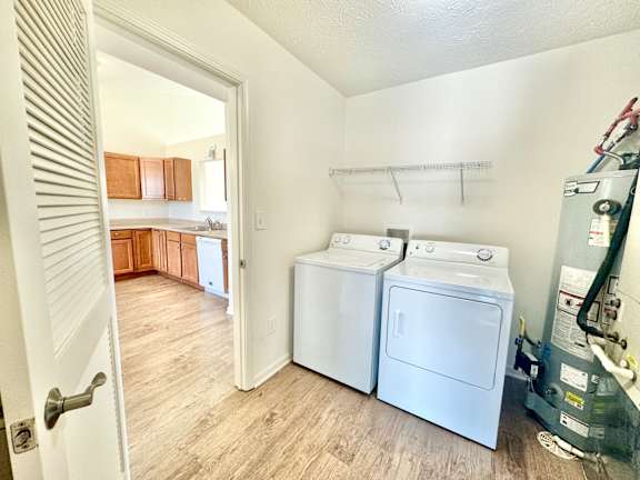 a laundry room with two washes and a dryer in it  at Hawthorne Properties in Lafayette, IN 47905