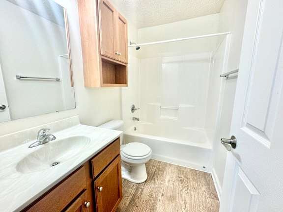 a bathroom with a sink toilet and a shower at Hawthorne Properties in Lafayette, IN 47905