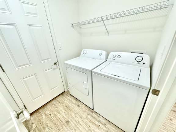 the laundry room has a washer and dryer and a door to the closet at Hawthorne Properties in Lafayette, IN 47905