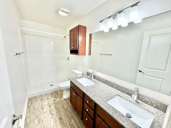 a bathroom with a sink and a toilet and a shower  at Hawthorne Properties in Lafayette, IN 47905