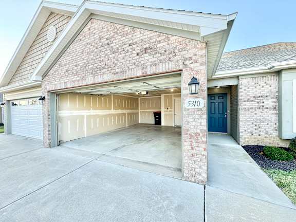 a large garage door in front of a house  at Hawthorne Properties in Lafayette, IN 47905