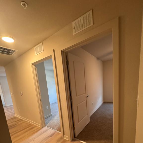 A skylight in a ceiling with a white door.