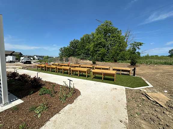 A park with a bench and a pathway.