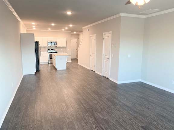 B2 (2-car) Downstairs open concept living and dining facing the kitchen