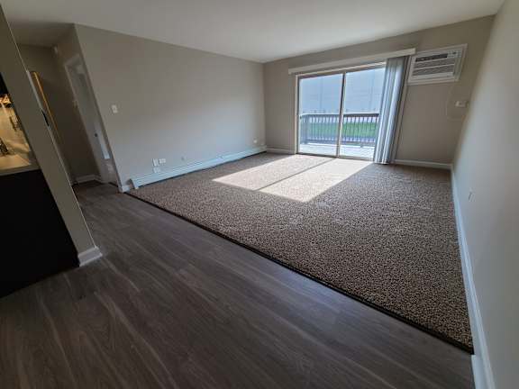 Living room with sliding door to patio/balcony