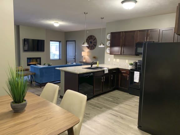 Kitchen and dining area in a Harper three bedroom floor plan apartment at North Point Villas in Lincoln Ne