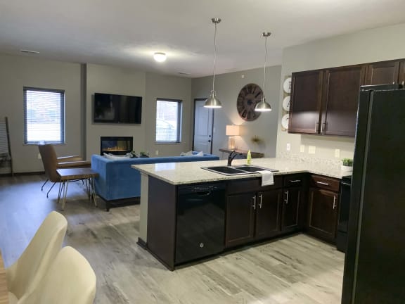 Kitchen and dining area in a Harper three bedroom floor plan apartment at North Point Villas in Lincoln Ne