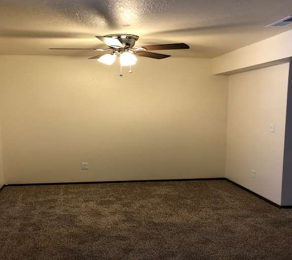 a living room with a couch and a table and a television
