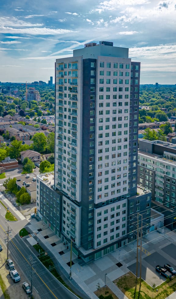 an aerial view of a tall building in a city