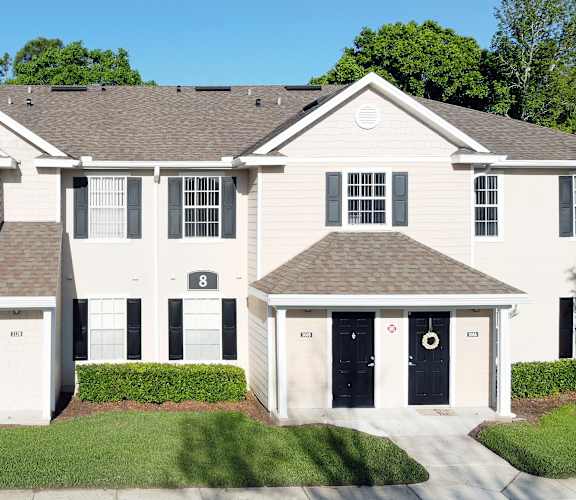 a large white house with black doors