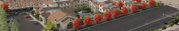 A street view of a residential area with houses and trees.
