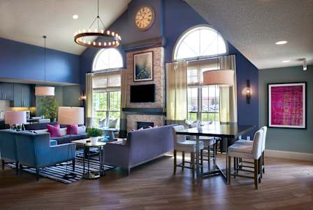 resident clubhouse with an internet café and cozy fireplace