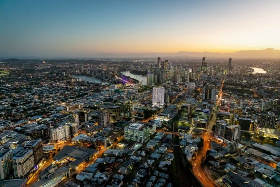 an aerial view of the city at sunset