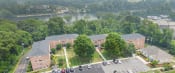 Thumbnail 1 of 34 - an aerial view of a parking lot in front of a building