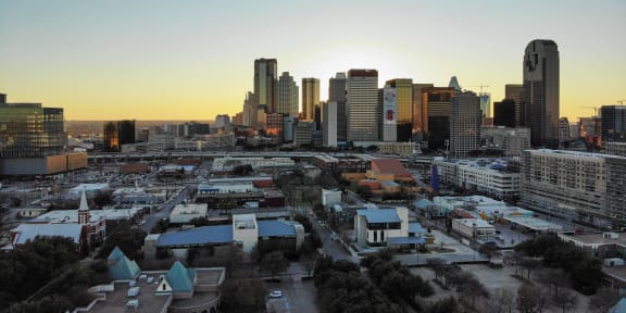 a view of the downtown houston skyline at sunset