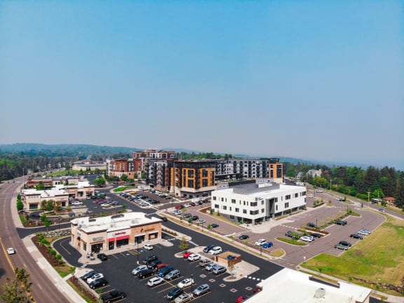 an aerial view of a city with buildings and a parking lot  at Vue at Bluestone, Duluth, Minnesota