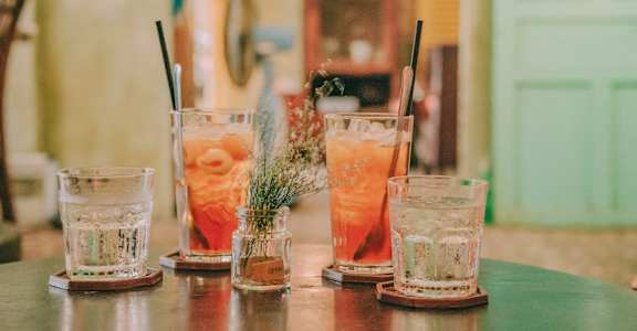 a group of cocktails sitting on top of a table