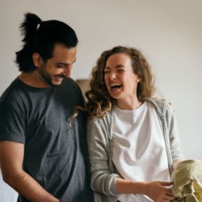 a man and a woman laughing in a room at Arlo Luxury homes Apartments, Little Rock, Arkansas