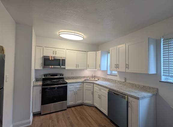 Kitchen with Island  at Pacific Highlands Apartments, Natrona Heights, PA