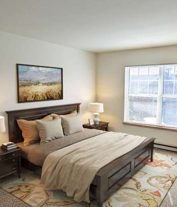 a bedroom with a bed and a window