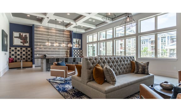 a living room with a couch and chairs
